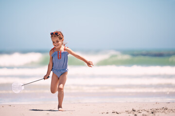 Canvas Print - She was born to beach. a little girl running along the beach.