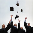 © Nicola Katie/peopleimages.com - We did it. A group of students throwing their caps into the air after graduation.