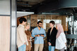 © Drobot Dean - Group of colleagues having discussion during meeting in modern office