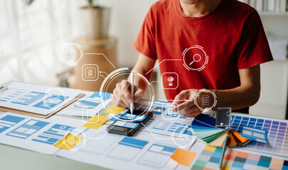 UX graphic designer planning application process development prototype wireframe for web smart phone. Creative digital development agency.