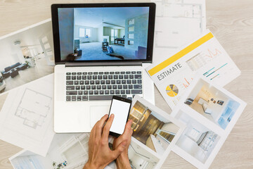 top view of Designer hand working with laptop computer on wooden desk as responsive web design concept