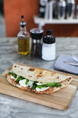 Wall Mural - Italian cuisine , Piadina with Italian ham and cheese