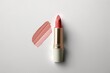 Creamy neutral tone cosmetic samples and single nude lipstick on white background. Generative AI