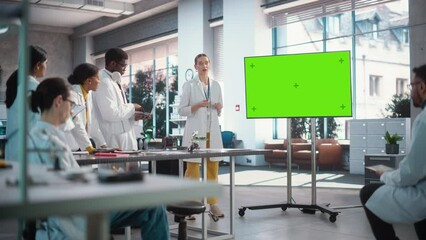 Aufkleber - Group of Students Listening to Their Robotics Female Professor Who Uses Green Screen Monitor in a Laboratory. Team of Engineers Having Meeting and Discussing Manufacturing Ideas, Using Technology