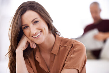 Wall Mural - Im a proud wife of a happy husband. a smiling young woman and her mature husband reading the newspaper at home.