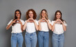 © gpointstudio - Four young caucasian women wearing blue jeans and white tshirt showing hearts made of hands