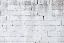 White-painted Cinder Block Wall Weathered By Time.