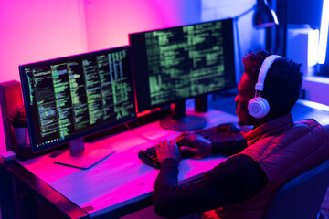 Software developer coding on his computer. Coding and hacking concept..
