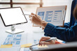 © NINENII - Creative male and women web designer planning application development for web mobile phone at modern workplace.