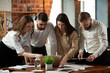 © master1305 - Project preparation. Motivated young people, employees having business meeting at office, working with papers, analytics documents. Concept of business, teamwork, career development, brainstorming