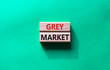 © Natallia - Do grey market. Wooden blocks with words grey market. Beautiful green background. Business and grey market concept. Copy space.