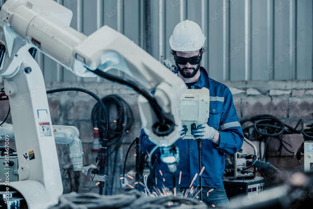 A trained and experienced robotic technician uses computer-controlled ...