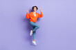 © deagreez - Full length photo of young overjoyed stylish outfit peaceful girl jumping show v-sign have fun peace everyone isolated on violet color background