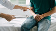© Ratirath - Male patient consulting a medical specialist at hospital. Prostate cancer, erectile dysfunction, urinary tract inflammation