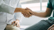 © Ratirath - Shaking hands, Male patient consulting a medical specialist at hospital.