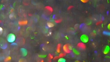 Canvas Print - Abstract Motion Of Rainbow Bokeh. Shiny defocused circles move abstractly on a light background. Multicolored bokeh lights with gradient overflows of colors.