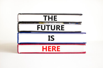Wall Mural - The future is here symbol. Concept words The future is here on books. Beautiful white table white background. Motivational business the future is here concept. Copy space.