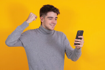 Canvas Print - isolated young man with mobile phone