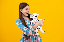 Childhood, Toys And Kids. Cute Teen Girl Cuddling Fluffy Toy.