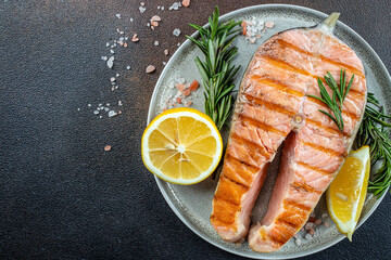 Wall Mural - Fresh cooked delicious salmon steak baked on a grill. Restaurant menu, dieting, cookbook recipe top view