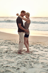 Sticker - Still so in love...A loving couple standing on the beach at sunset.