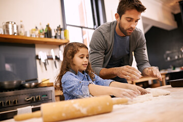 Sticker - Shell be an expert masterchef one day. a little girl and her dad working with pizza dough in the kitchen.