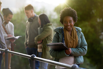 Canvas Print - Im ready for class. Cropped portrait of a young woman standing on campus with other students in the background.