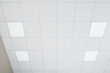 © New Africa - White ceiling with modern lighting in room, low angle view
