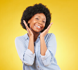 Black woman, hands on face and smile portrait in studio while excited on yellow background. African female model with afro, beauty and happiness on color space with motivation and positive mindset