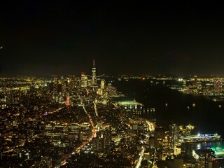 Wall Mural - The lights of Manhattan glow bright, as seen from Edge, an observation deck atop a high rise at Hudson Yards