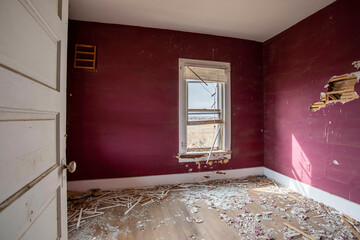 Red bedroom of old abandoned farm house
