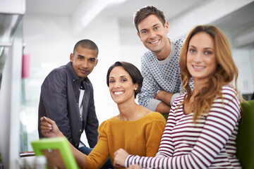 Aufkleber - Teamwork with a smile. Cropped view of a group of young designers working together.