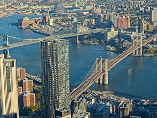 Wall Mural - Looking down on Manhattan and the Brooklyn Bridge from atop the One World Observatory at One World Trade Center, the tallest building in the Western Hemisphere rising to a symbolic 1,776 feet