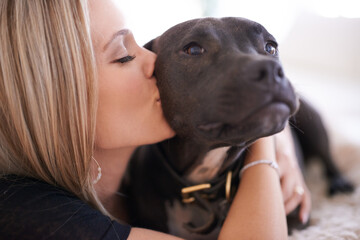 Poster - Shmoochie boochies. a young woman kissing her dog on the cheek.