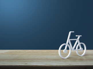 Wall Mural - Bicycle 3d icon on wooden table over light blue wall, Business bicycle service concept