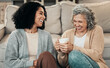 © Allistair/peopleimages.com - Love, mother and adult daughter on floor, coffee and conversation with happiness, break and laughing. Family, mama and female grown child on ground, tea and smile with rest, funny and quality time