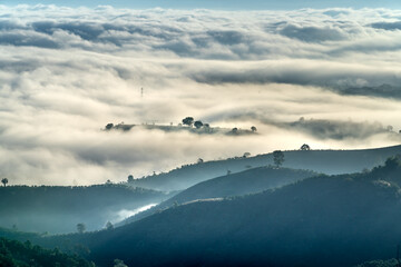 Wall Mural - Fanciful scenery of an early morning when the sun rises over the Dai Lao mountain range, Bao Loc district, Lam Dong province, Vietnam