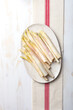 Bunch of raw white asparagus on white wooden table. Top view, copy space