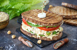Fototapeta  - Chickpea salad sandwich prepared and served