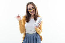 Attractive Young Woman With Glasses And A Glass Of Lemonade On A White Background