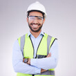 © Joanrae/peopleimages.com - Construction worker in portrait, man with crossed arms and smile, architect or engineer in building industry on studio background. Happy contractor, professional builder with helmet and goggles