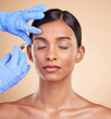 © Rethea B/peopleimages.com - Studio, face lift or Indian woman with injection for beauty, plastic surgery or medical cosmetics. Skincare, dermatology or hands with needle in filler facial treatment on young girl with eyes closed