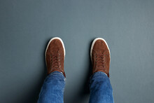 Man In Stylish Sneakers Standing On Grey Background, Top View