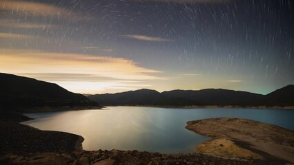 Poster - star nightlapse reflects on water of high island west dam sai kung hong kong