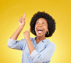 Poster - Studio promotion, excited and black woman point up at mock up space, advertising mockup or marketing promo. Commercial girl, gesture and happy person with product placement deal on yellow background