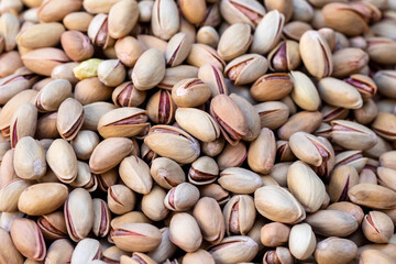 Wall Mural - Pistachios texture and background. Roasted and salted pistachios in shell (texture, background).