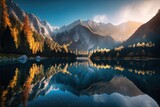 Fototapeta Góry - Sunrise at Jasna Lake in Slovenia's Kranjska Gora National Park. Amazing autumn scenery featuring the Alps, trees, a blue sky with clouds, and a reflection in the water, a well known tourist destinati