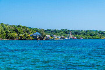 Wall Mural - A view towards a village on Roatan Island on a sunny day