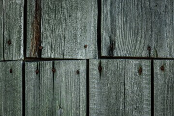 Wall Mural - Grunge dark wood background with rusty nails