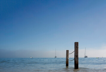 Wall Mural - view of the Poetto beach with two poles and ropes in Cagliari